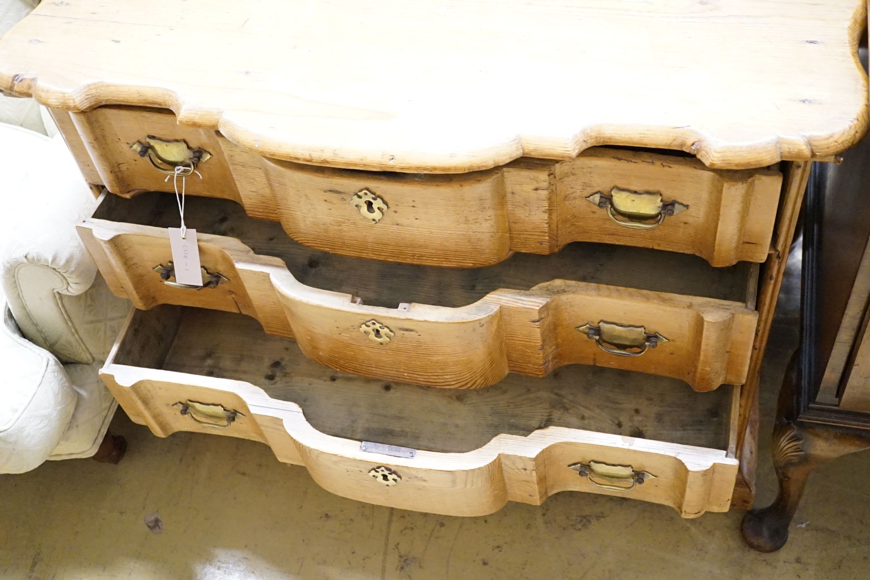 A 19th century Dutch pine Cupid’s bow shaped chest fitted four drawers, width 92cm, height 80cm
